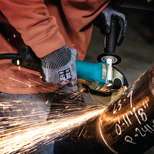 Makita GA5053R Action Shot 5 (cutting pipe) - Thumbnail